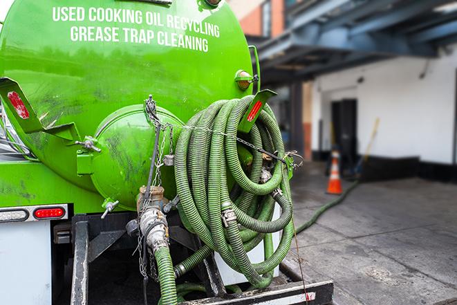 expert technicians performing grease trap pumping in Key Largo